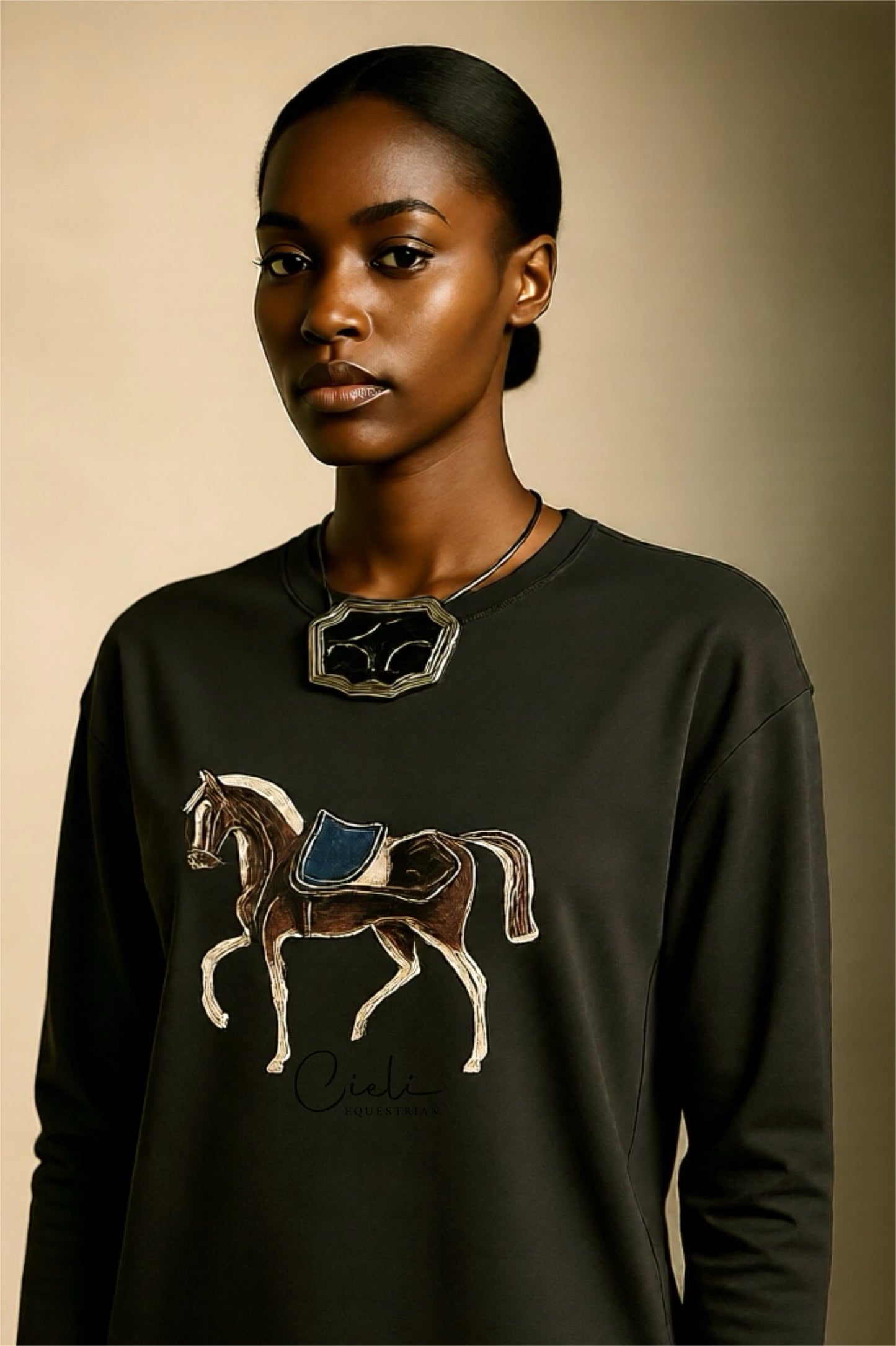 Woman wearing a Green sweatshirt with a horse design on a beige background