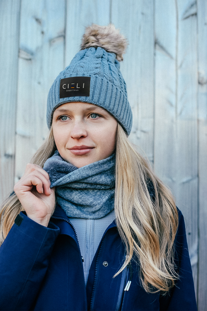 Lady wearing a Signature Cieli Equestrian snood scarf in grey ideal for horse riding winters