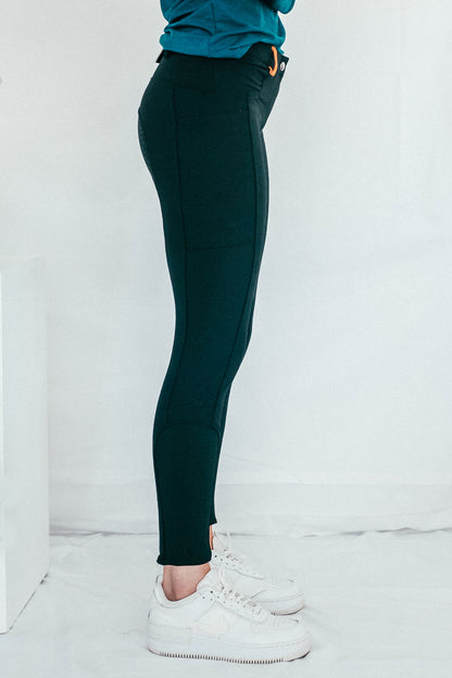 Lady wearing everyday black equestrian pants, resembling a sporty twist on modern riding breeches.