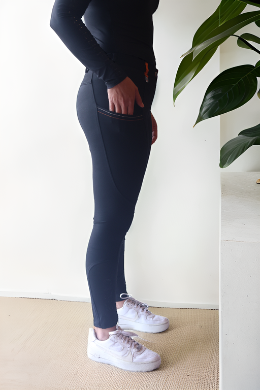 Lady wearing Cieli Equestrian everyday Chicago black equestrian pants, resembling a sporty twist on modern riding breeches also ideal for horse safari..