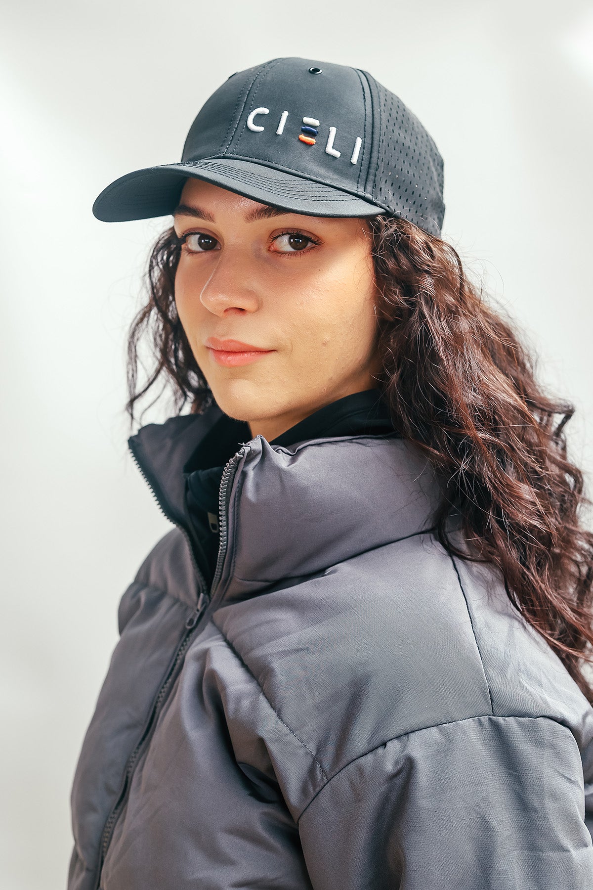 A Cieli Equestrian peak mesh baseball cap in royal black ideal for horse safari.