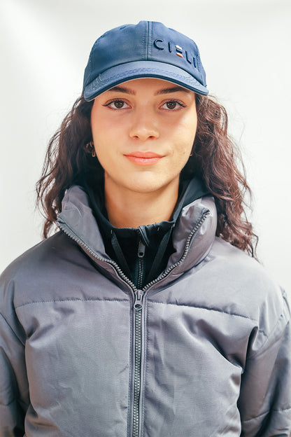 A Cieli Equestrian peak mesh baseball cap in navy blue ideal for horse safari.