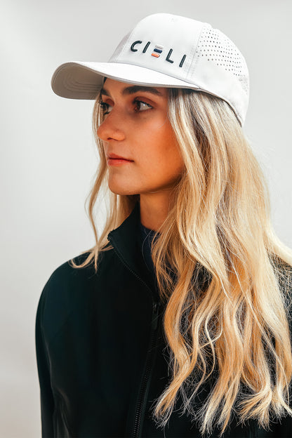 A Cieli Equestrian peak mesh baseball cap in royal white ideal for horse safari.