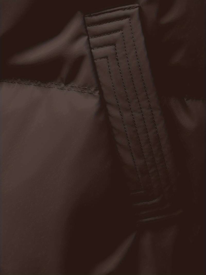 Close-up of a brown fabric texture with stitching detail