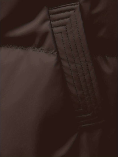 Close-up of a brown fabric texture with stitching detail