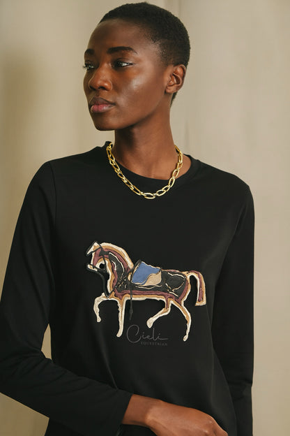 Person wearing a black sweater with a horse graphic and 'Cieli' branding.