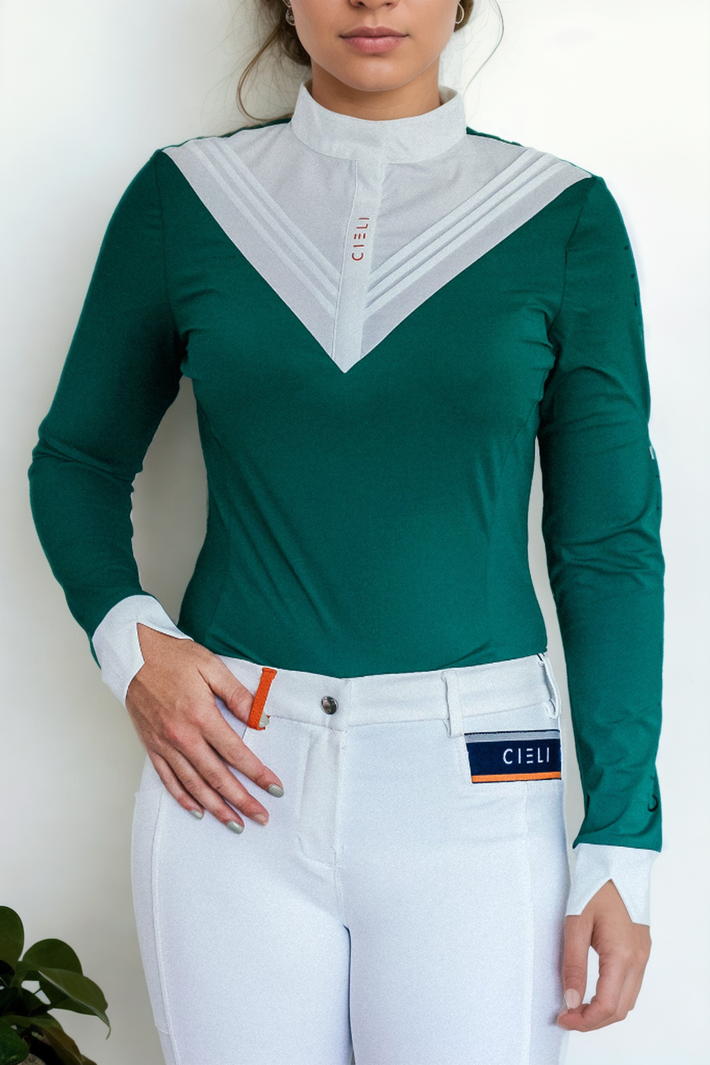 Ladies Cieli Equestrian riding long sleeve show shirt in green with white bib and magnetic closure.