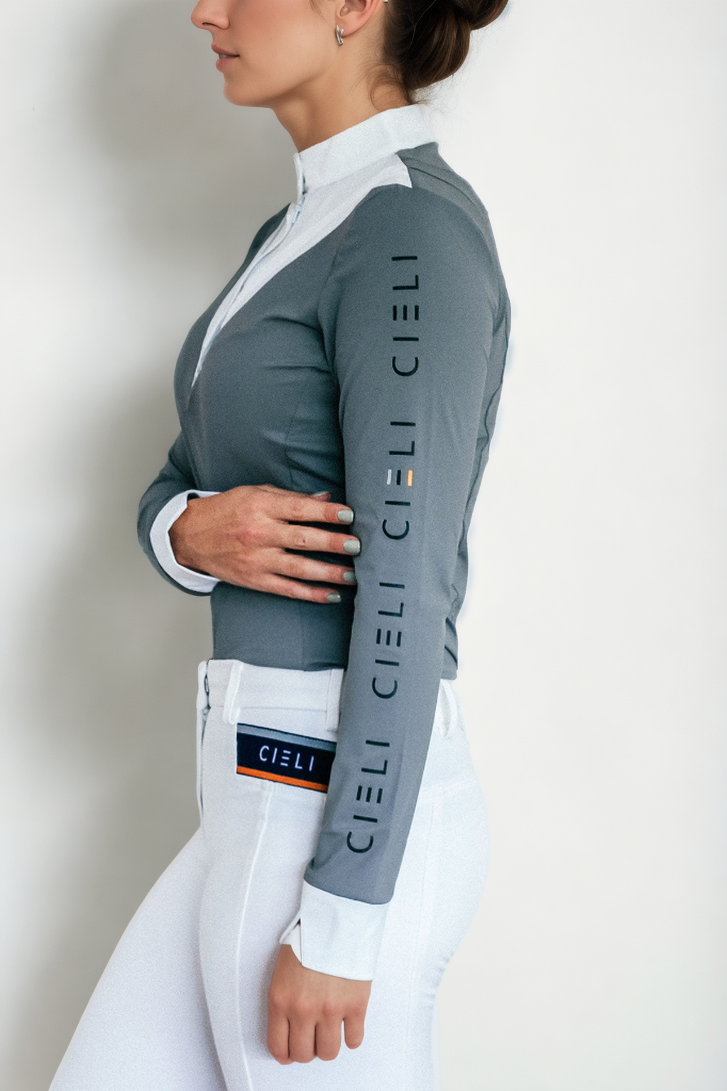 Ladies Cieli Equestrian riding long sleeve show shirt in grey with white bib and magnetic closure.