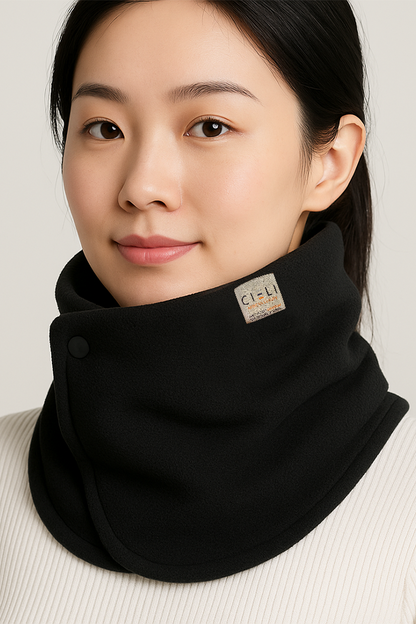 Woman wearing a black neck warmer with a visible brand logo on a plain background