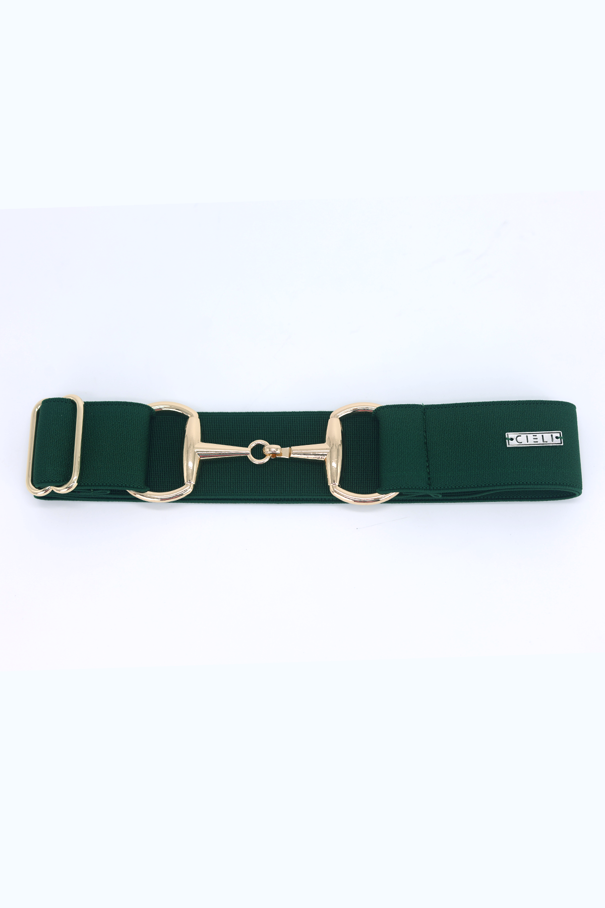 lady wearing a Cieli Equestrian elastic snaffle bit belt in green with a gold buckle that is one size fits all