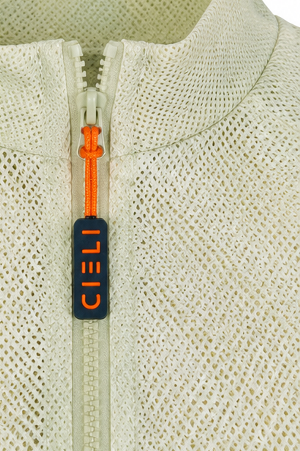 Close-up of a textured fabric garment with a zipper and 'CIELI' brand tag.
