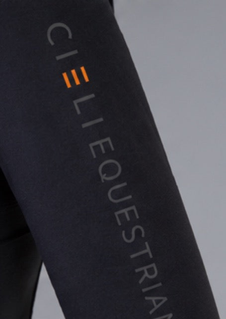 Close-up of a dark charcoal equestrian apparel sleeve featuring the vertical text 'CIELI EQUESTRIAN' in light gray with three orange bars as the 'C'.