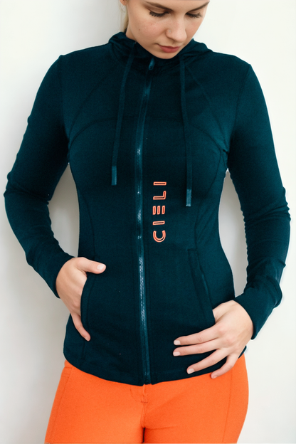 Lady wearing a Cieli Equestrian black jacket with hood, ideal for riding and African horse safaris.