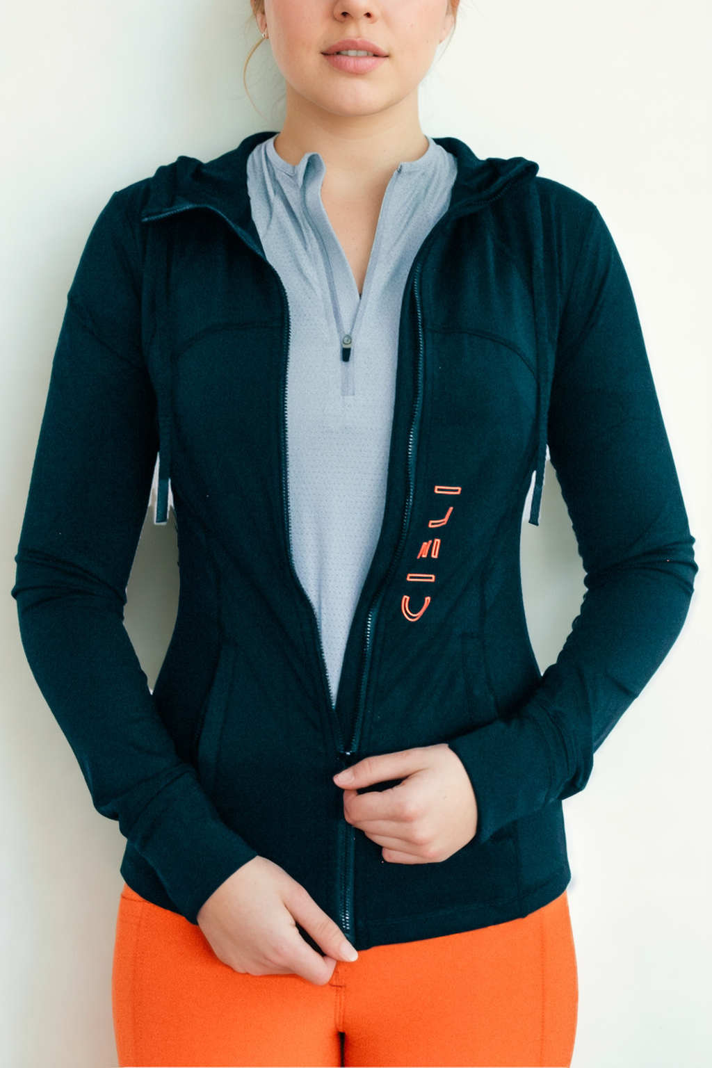 Lady wearing a Cieli Equestrian black jacket with hood, ideal for riding and African horse safaris.